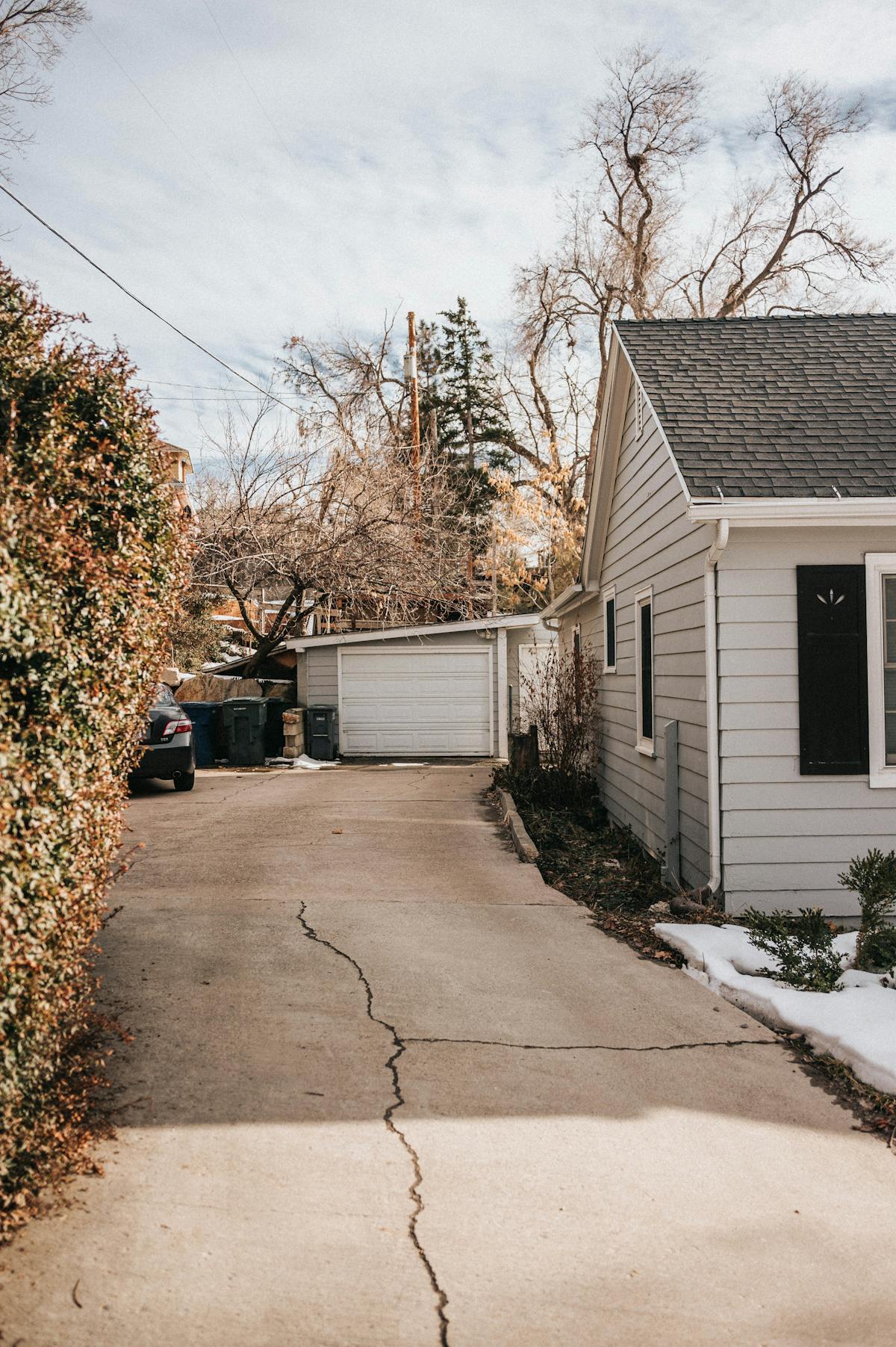 Residential concrete driveway with a visible crack